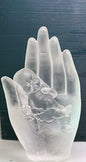 Hand holding baby